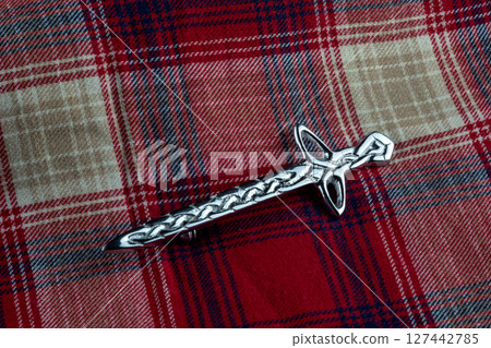 Scottish Traditional Kilt Pin on Tatran Cloth Closeup View 127442785