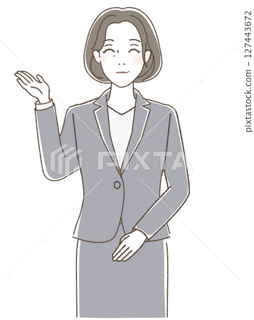 A woman in a suit smiling and raising her hand 127443672