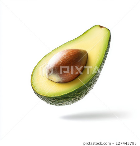 fresh avocado slice floating gracefully, showcasing its vibrant green color and smooth texture 127443793