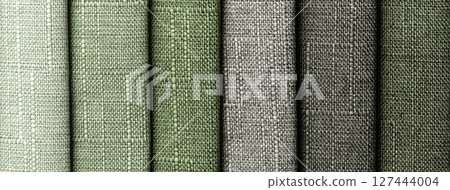 Woven fabric swatches in green and gray shades with coarse texture for upholstery and interior background 127444004