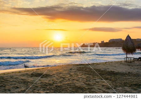 sunrise at the beach with gorgeous sky. summer getaway wallpaper on a black sea. vacation season. calm water and orange clouds. bulgaria travel background. sunny holiday seascape. sun above horizon 127444981