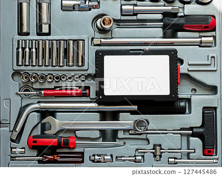 A collection of various hand tools arranged neatly in a toolbox. A collection of various hand tools arranged neatly in a toolbox. 127445486