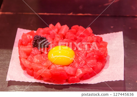 Fresh beef tartare with egg and spices Fresh beef tartare with egg and spices 127445636