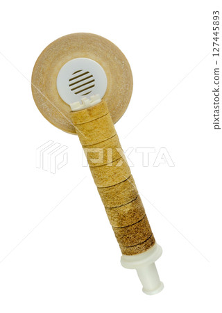 Old, dirty, and well-used water filter set against a white background Old, dirty, and well-used water filter set against a white background 127445893