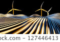 A group of windmills on top of a hill with a black background 127446413