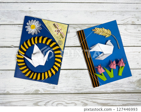 Victory Day cards with origami dove, tulips, crane, and St. George ribbon. Handmade paper crafts honoring WWII heroes and patriotic remembrance of historical victory 127446993