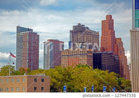 Downtown NYC architecture with trees and flag Downtown NYC architecture with trees and flag 127447338