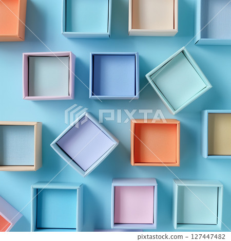 Multicolour paper gift boxes in the blue background, top view 127447482