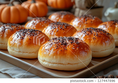 Delicious baked buns. Variety of baked buns in on a wooden trading tray on a white background. Delicious baked buns. Variety of baked buns in on a wooden trading tray on a white background. 127447896
