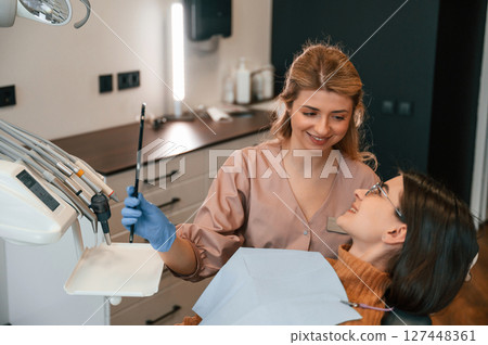Young woman is in the chair. In the stomatological cabinet 127448361