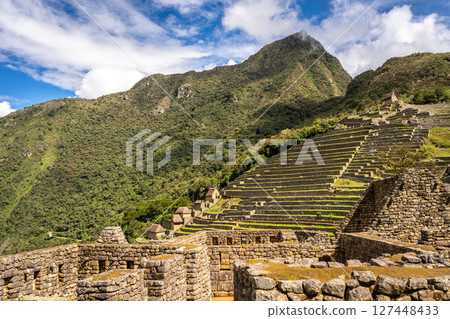 Panoramic view of Machu Picchu ruins with Huayna Picchu in background, Peru 127448433