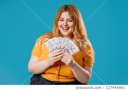 Body Positive Woman With Money. Plus size Lady, Usd Dollars Banknotes On Blue 127448461