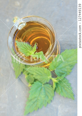 Nettle tea made from nettles Urtica dioica, flat lay. Nettle tea made from nettles Urtica dioica, flat lay. 127449139