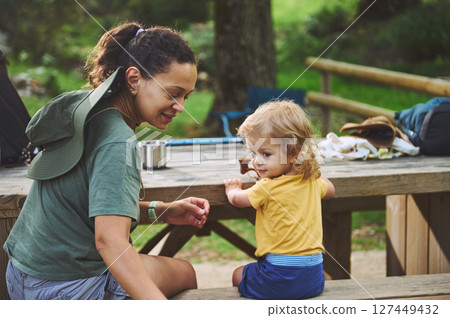 A Mother and Child Enjoying Quality Time Outside in a Peaceful Natural Setting 127449432