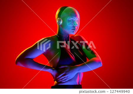 Neon helmeted woman illuminated in red light with tattooed arm. Future media 127449940