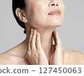 A Japanese woman in her 40s working on anti-aging care for her neck 127450063