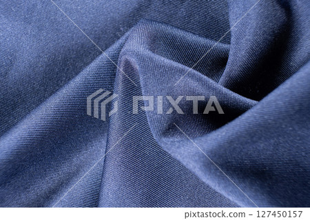 Rich blue fabric macro background. 127450157