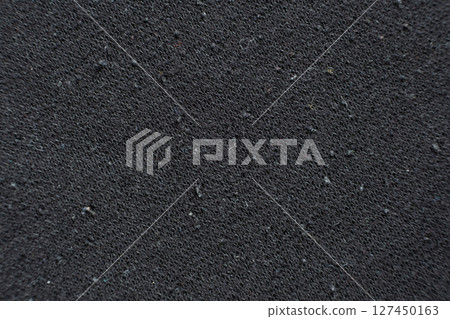 Old worn-out fabric with damaged structure, protruding threads. Old worn-out fabric with damaged structure, protruding threads. 127450163