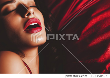 beautiful sexy woman lies on the bed and screams from orgasm during sex in bedroom beautiful sexy woman lies on the bed and screams from orgasm during sex in bedroom 127450403