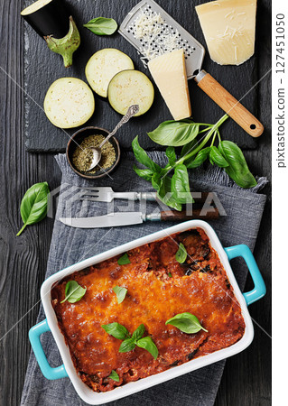 Eggplant Parmigiana in a baking dish, top view 127451050