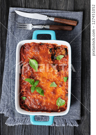 Eggplant Parmigiana in a baking dish, top view 127451052