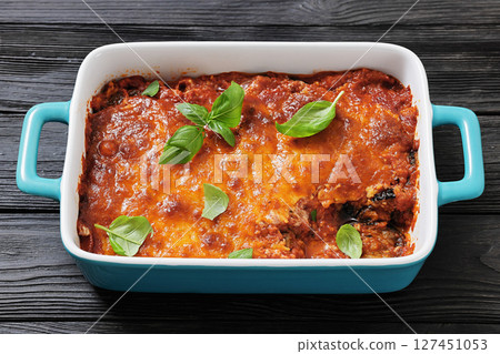 Eggplant Parmigiana in a baking dish, top view 127451053