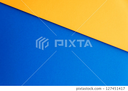 Cyan square on a red sheet, bold geometric paper background. 127451417