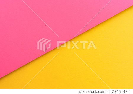 Pink and yellow paper in a flat diagonal design, aesthetic background. 127451421