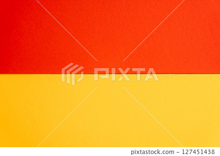 Horizontal layout of orange and yellow paper with clean separation. 127451438