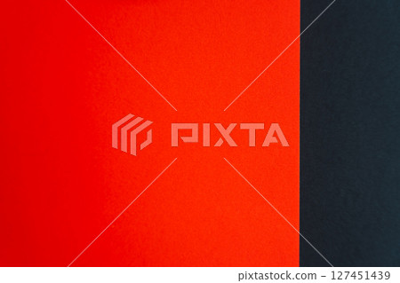 Red and black paper forming a vertical abstract background. Red and black paper forming a vertical abstract background. 127451439