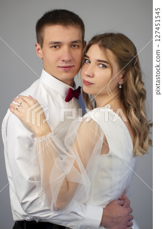 Vertical classic portrait of beautiful bride and groom. 127451545