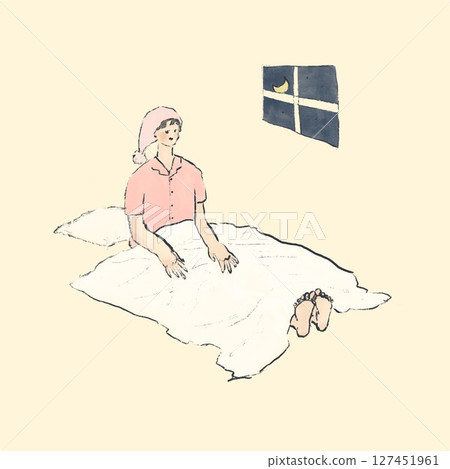 A woman in pajamas and a hat getting into bed at night 127451961