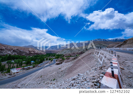 Mountain Road in a Desert Valley 127452102