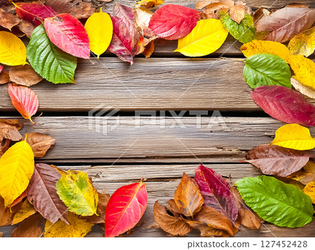 Image material of fallen leaves placed on a wooden board 127452428