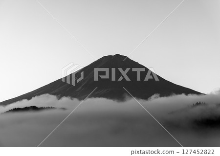 Minimalist monochrome photograph of Mount Fuji with deep shadows and mist Minimalist monochrome photograph of Mount Fuji with deep shadows and mist 127452822
