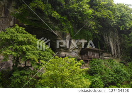 The goma hall standing on the rock face of Mount Chikushi's Fukoji Temple 127454598