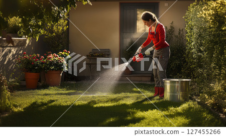 woman shirt pants hedge electric trimmer 127455266