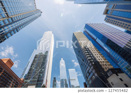 Vibrant sunny view of Chicago downtown skyline under a blue sky Vibrant sunny view of Chicago downtown skyline under a blue sky 127455482