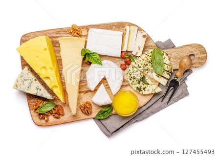 An assortment of various cheeses arranged on a board, highlighting different textures An assortment of various cheeses arranged on a board, highlighting different textures 127455493