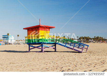 Vibrant lifeguard tower painted in LGBTQ rainbow colors 127455547