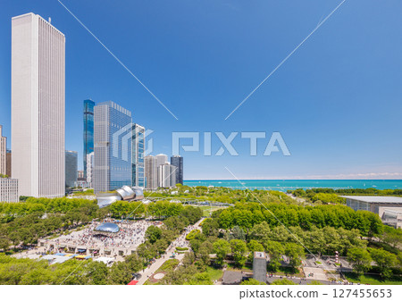 Vibrant sunny view of Chicago downtown skyline under a blue sky Vibrant sunny view of Chicago downtown skyline under a blue sky 127455653