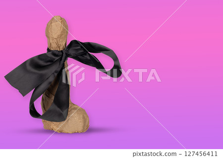 Wrapped Erotic Gift with Black Satin Bow 127456411