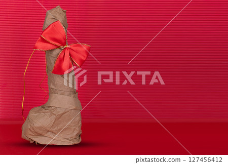 Wrapped Gift Vibrator with Red Bow 127456412