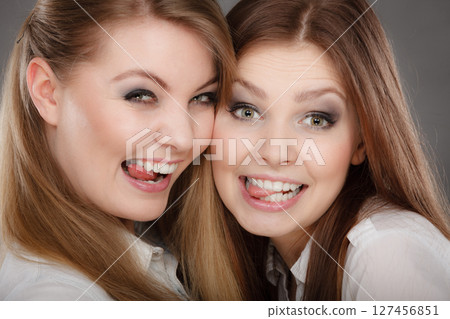 Charming positive female siblings. 127456851