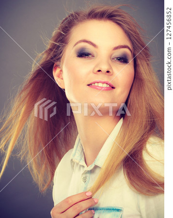 Attractive blonde woman with windblown hair 127456852