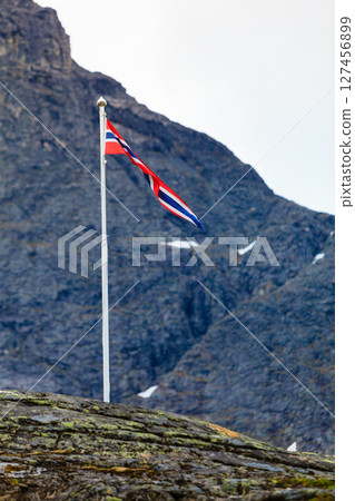 norwegian flag in rocky mountains 127456899