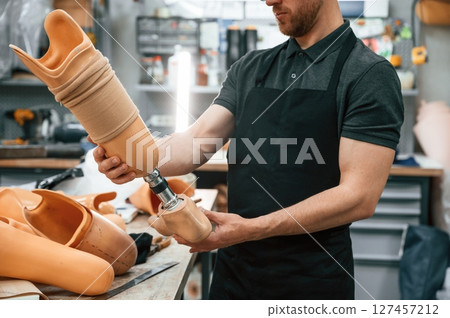 Close up view. Technician holding prosthesis in hands 127457212