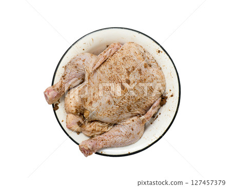Marinated chicken. 127457379