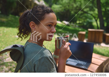 Woman Embracing a Digital Nomad Lifestyle in Nature 127458006