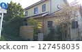 A wooden house surrounded by trees 127458035
